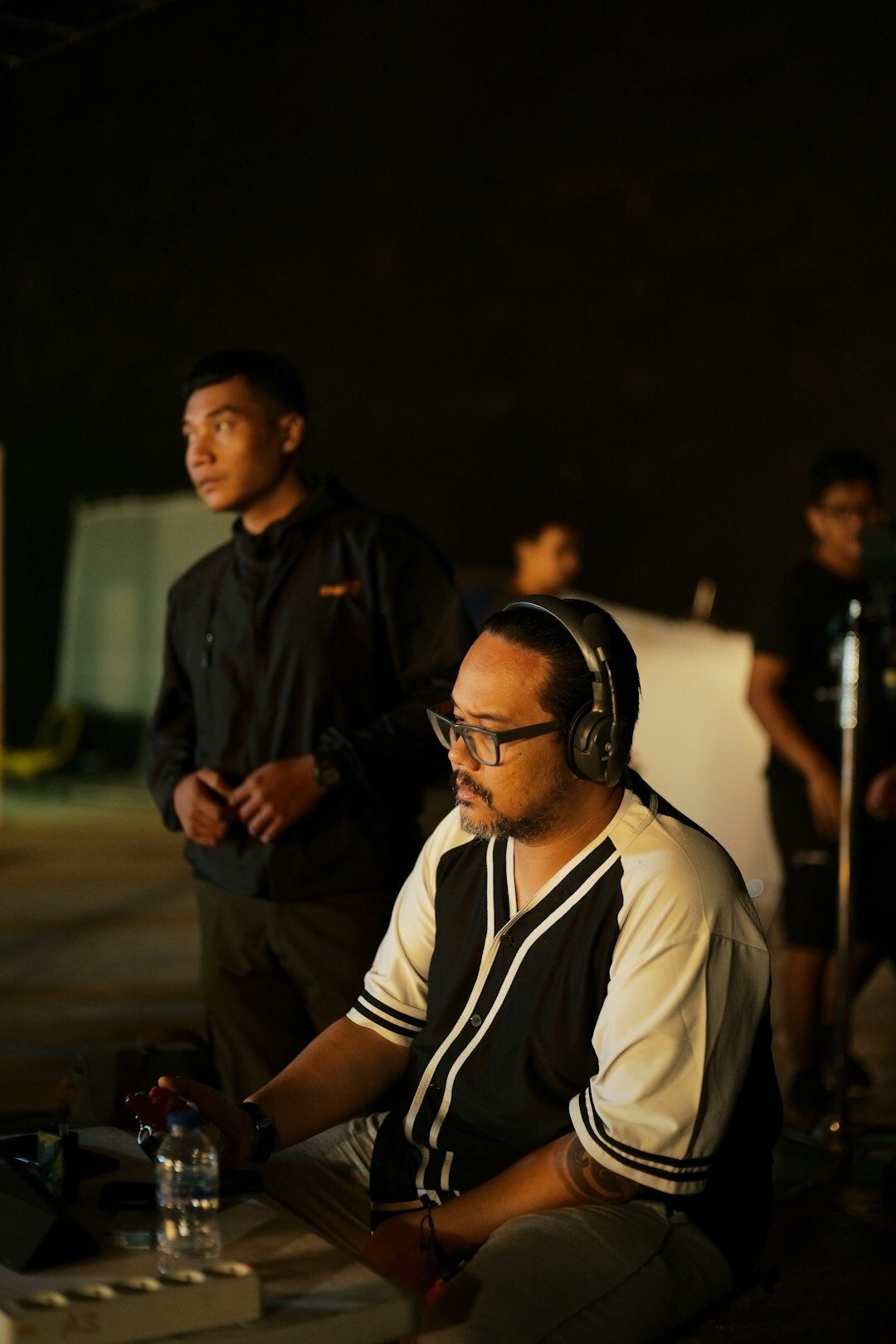 Students learning video switching at a training control room desk